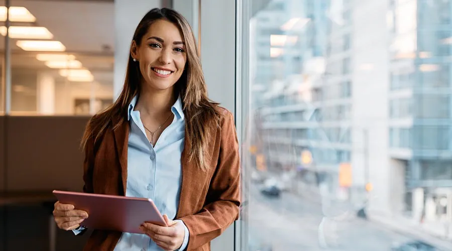page smiling-female professional-holding-red tablet