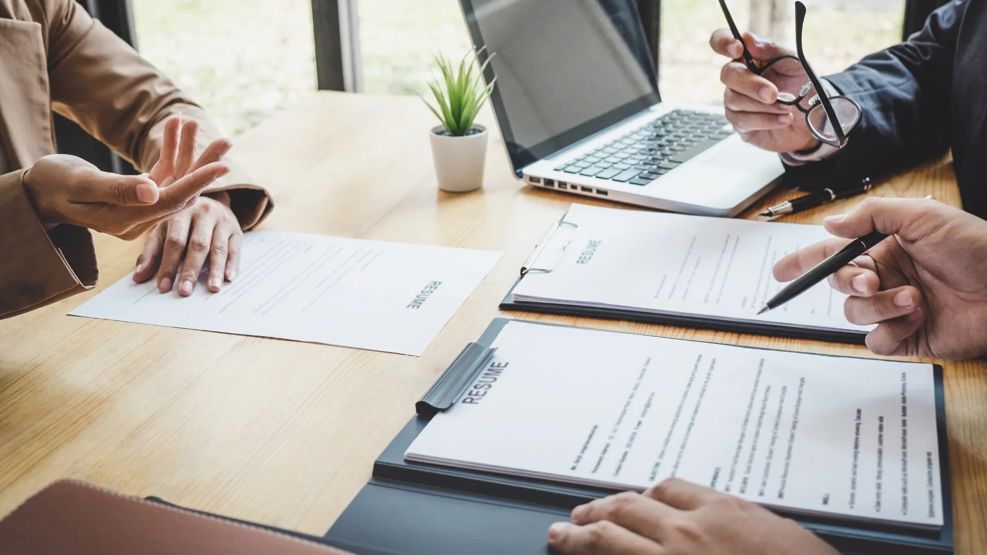 employers looking at a resume