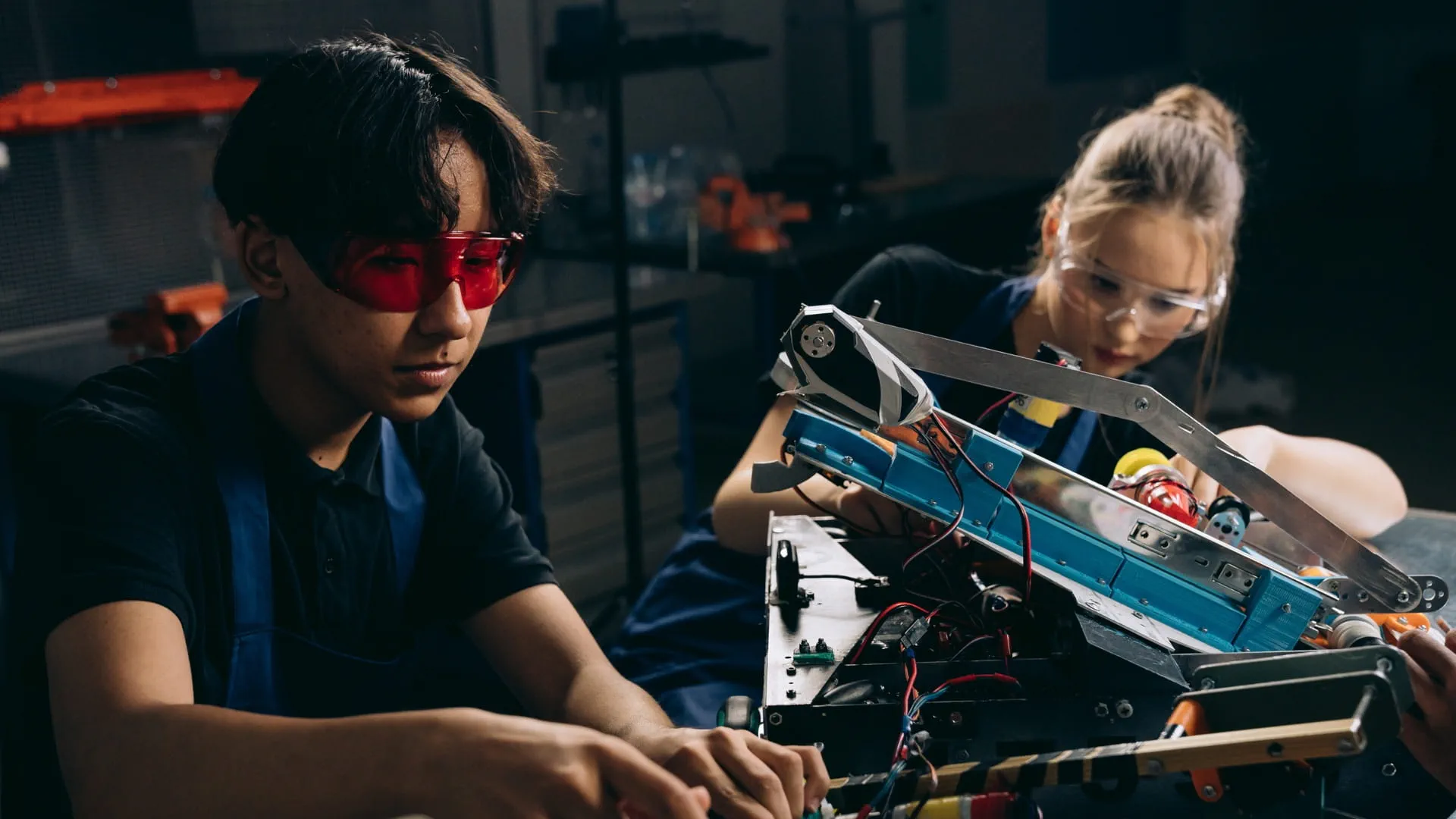 two engineers working on a device 