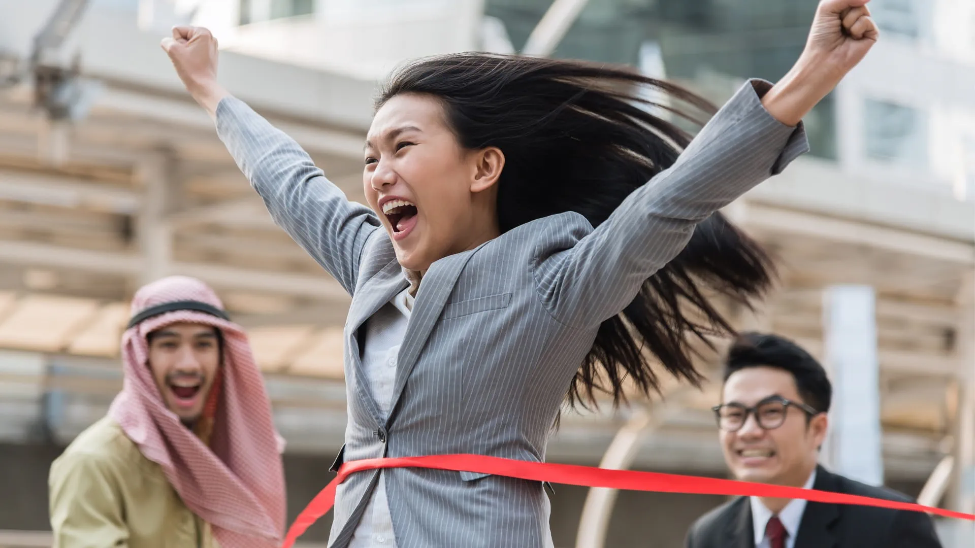 professional woman crossing the finish line 