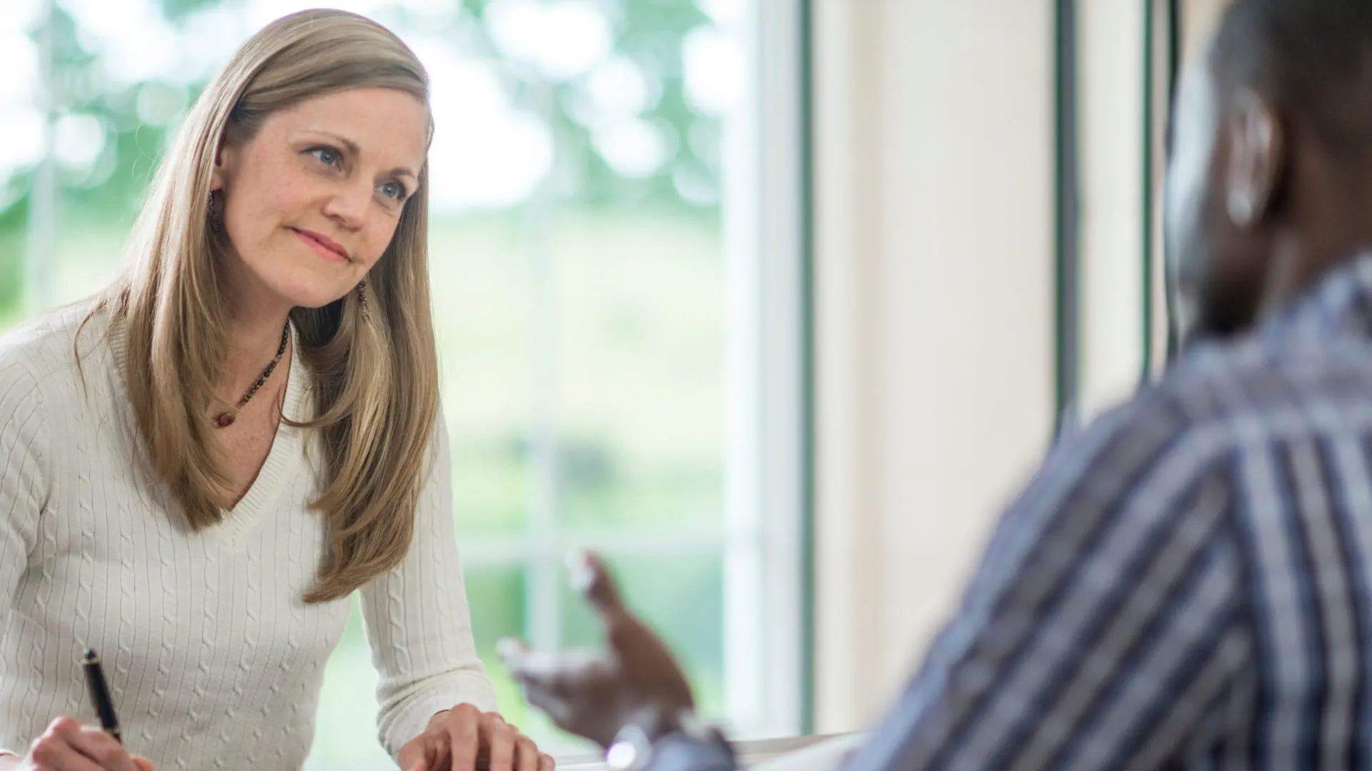 recruiter taking an interview with a candidate