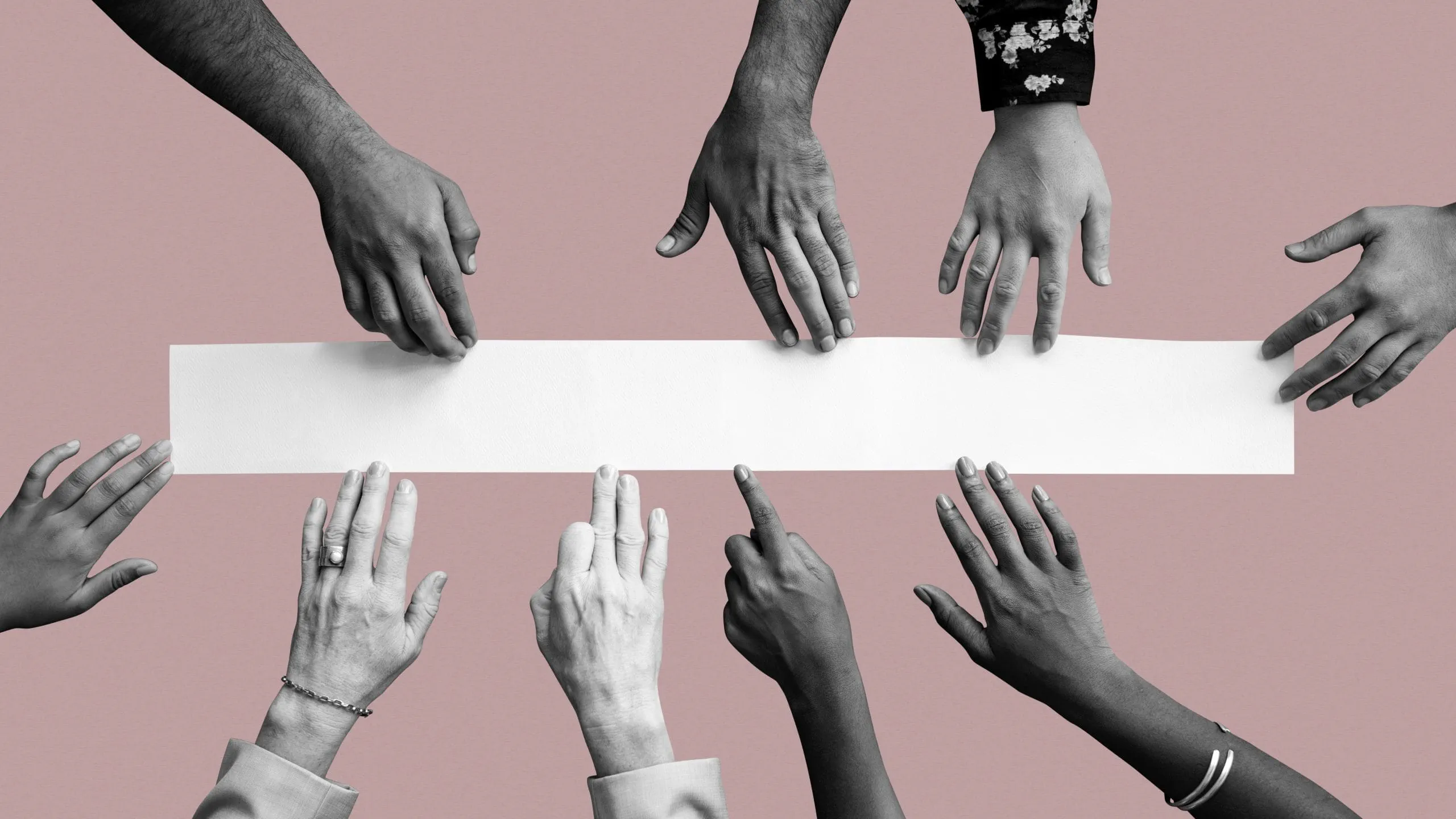 diverse-hands-touching-white-paper-scaled