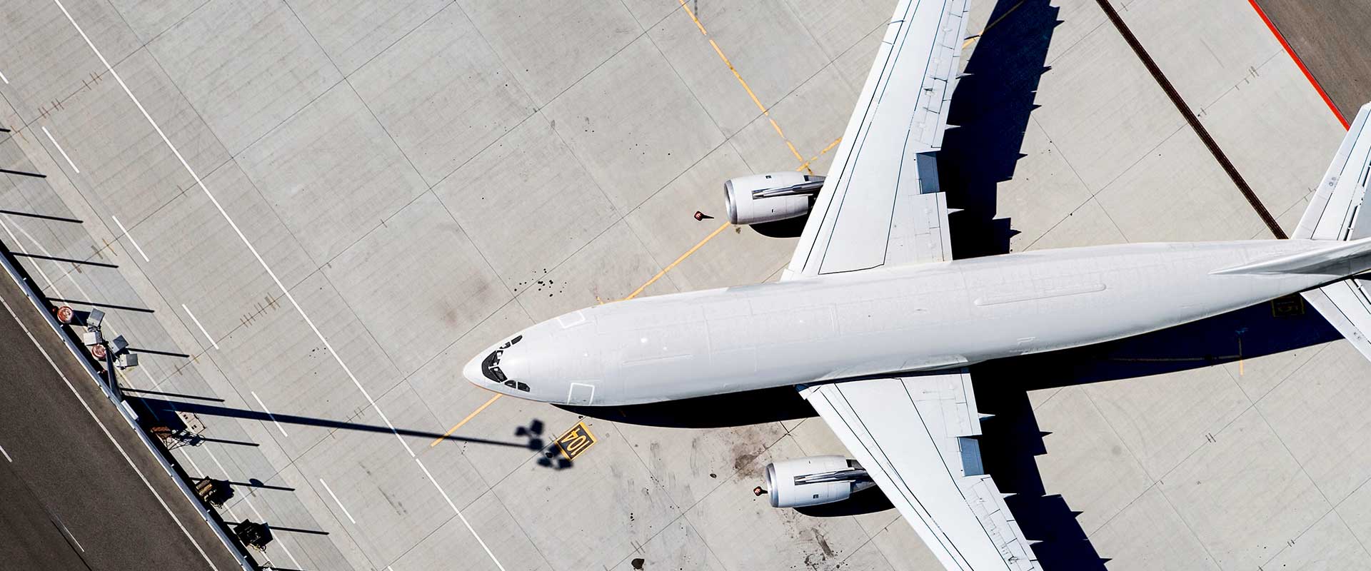 Aerial view of an airplane on the tarmac during pre flight operations