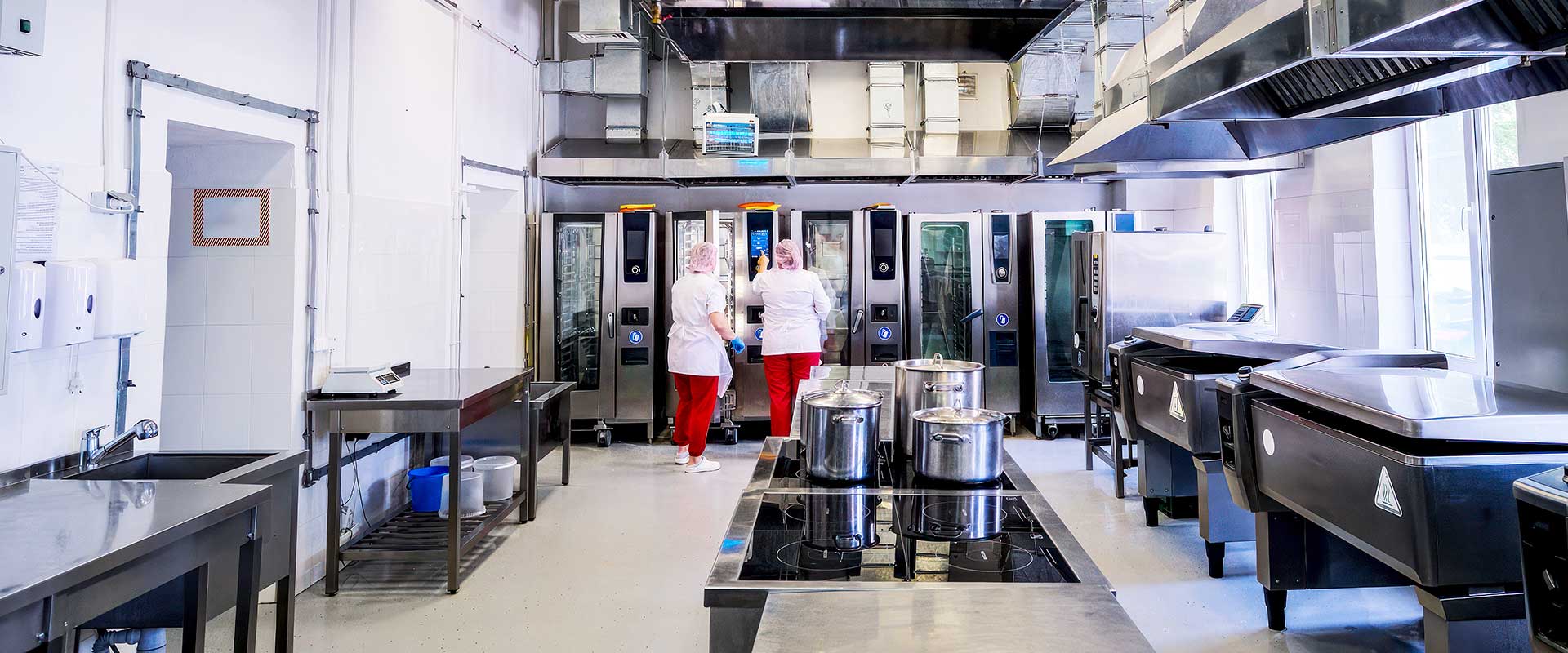 Clean commercial kitchen ready for food preparation and service
