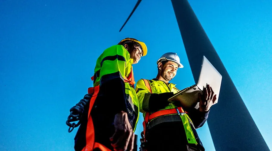 Workers reviewing plans at solar installation