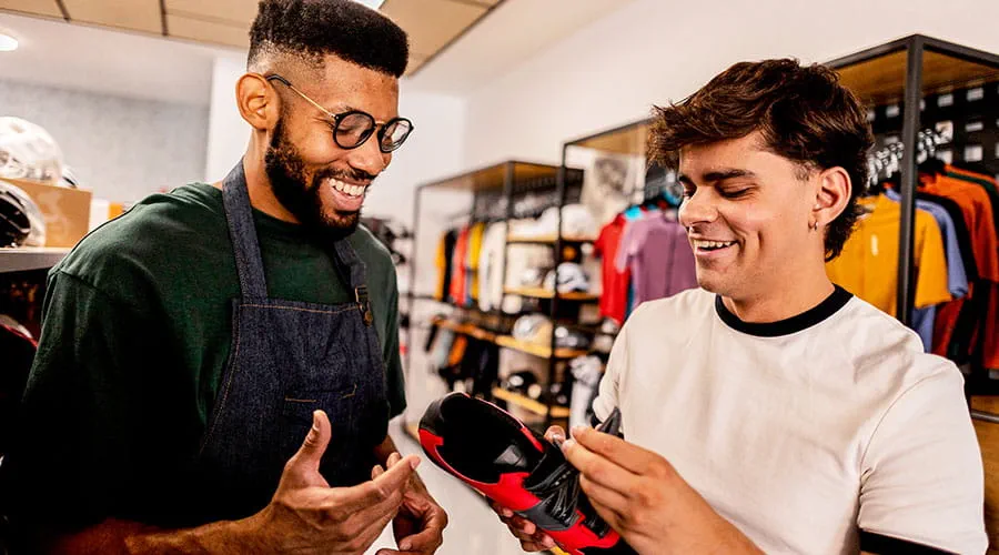 Two colleagues discussing products in store