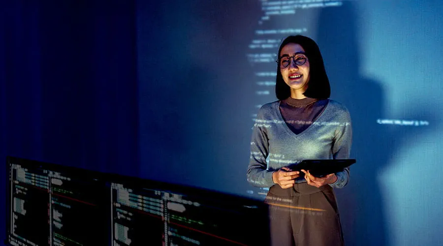 Person presenting data on digital screen