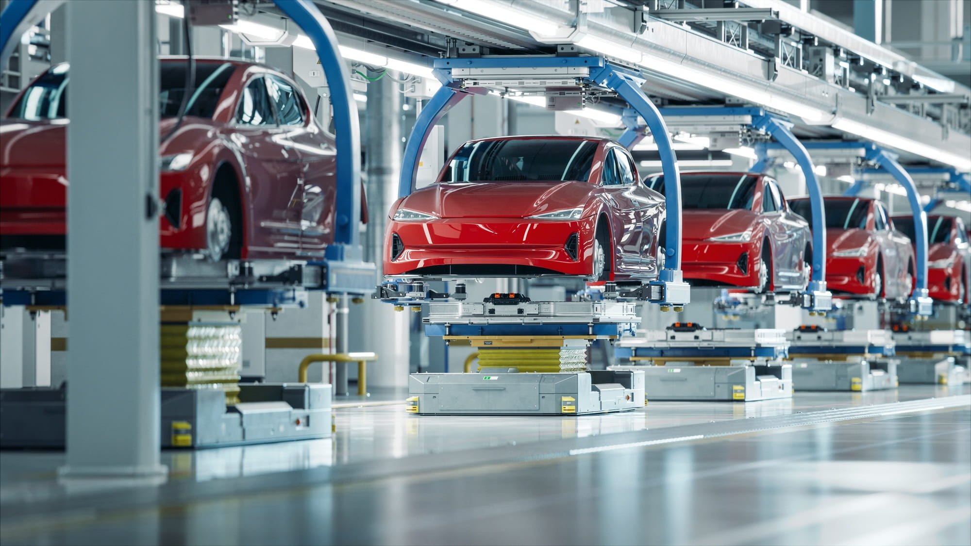 Autos stehen auf einem Fertigungsband in einer modernen Produktionshalle Autos stehen auf einem Fertigungsband in einer modernen Produktionshalle