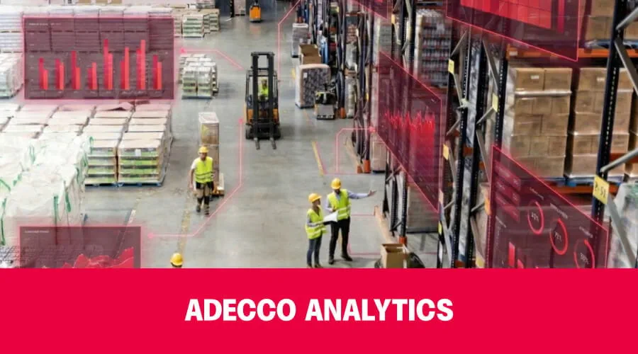 Warehouse aisle with red banner reading ADECCO ANALYTICS.