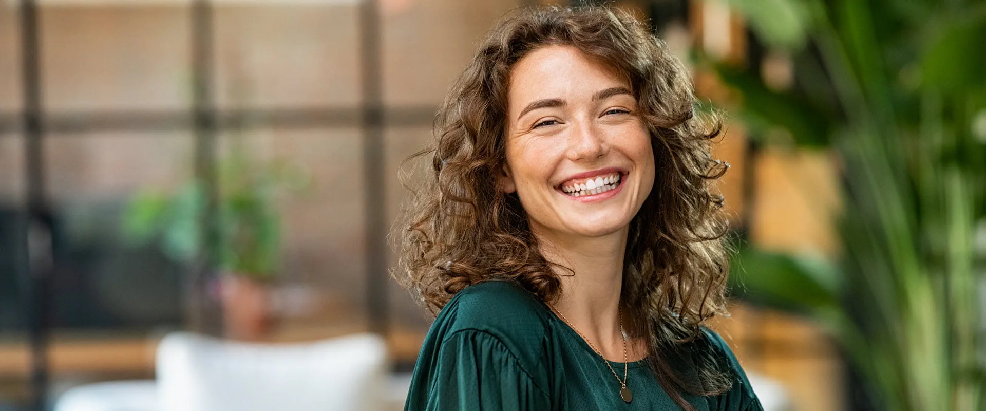 smiling professional woman with arms crossed