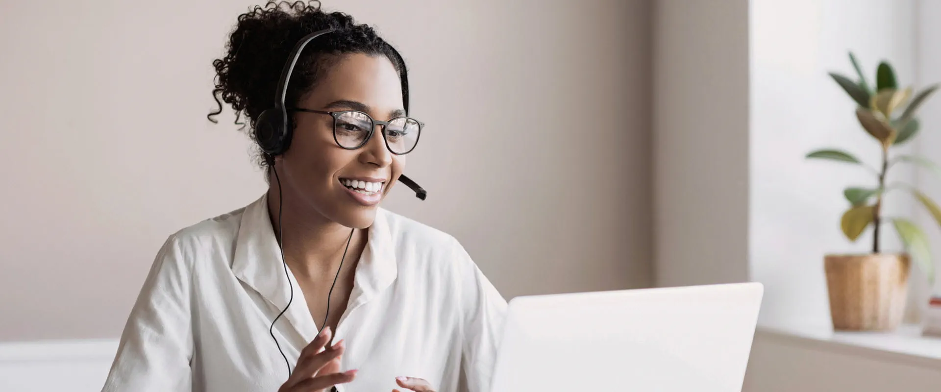 Person wearing headset have meeting online.