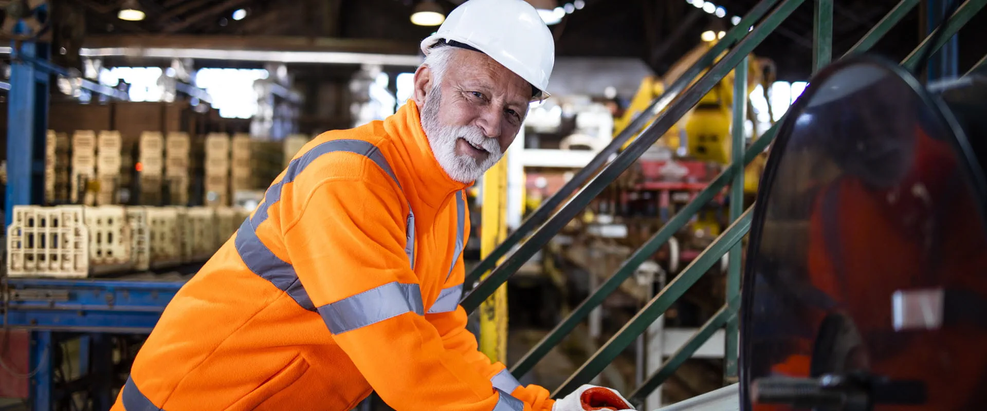 Factory worker operating industrial machine 