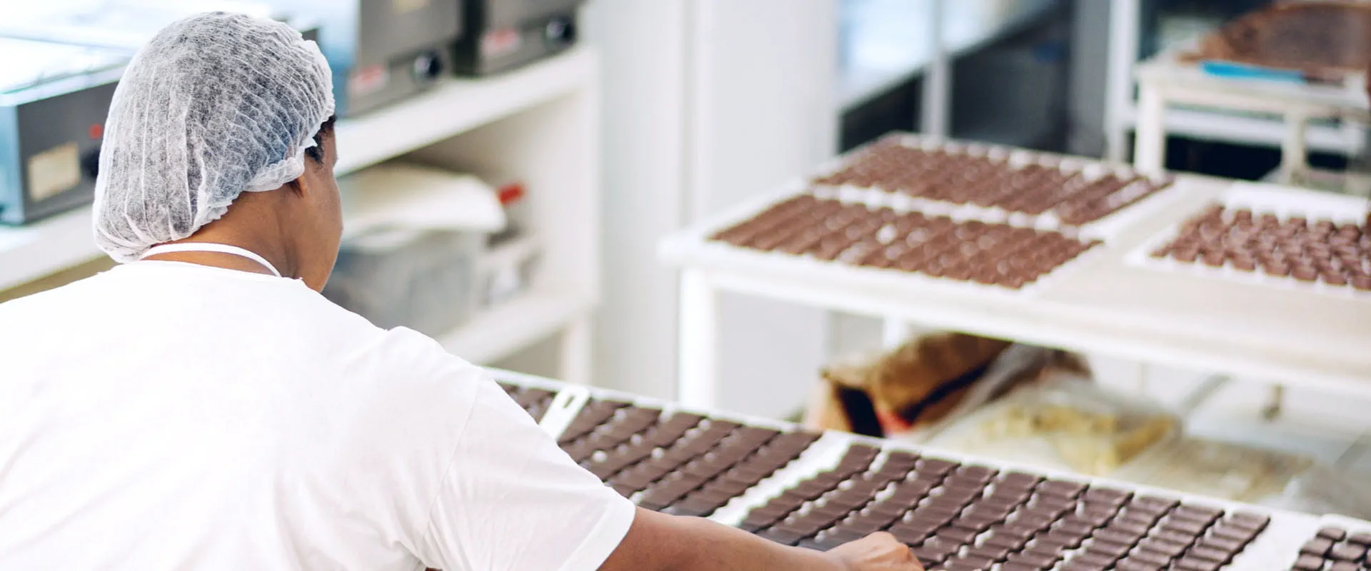 Person working in a chocolate factory