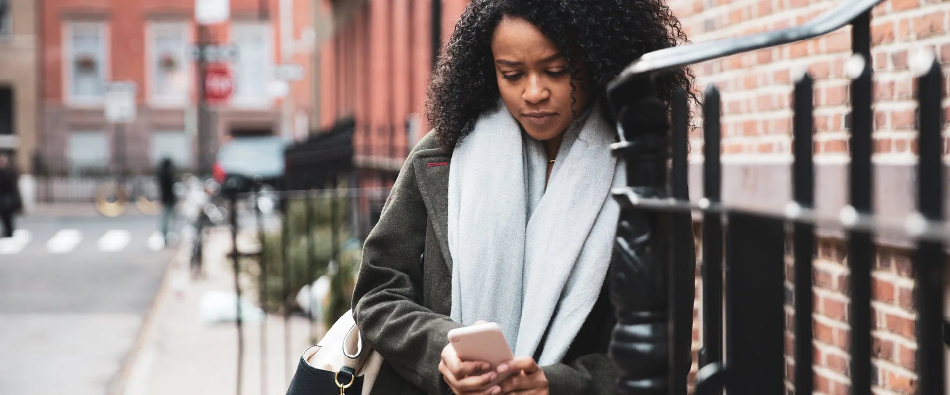 A New Yorker looks at their phone