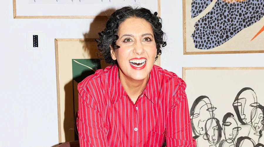  Woman smiling while sitting in living room