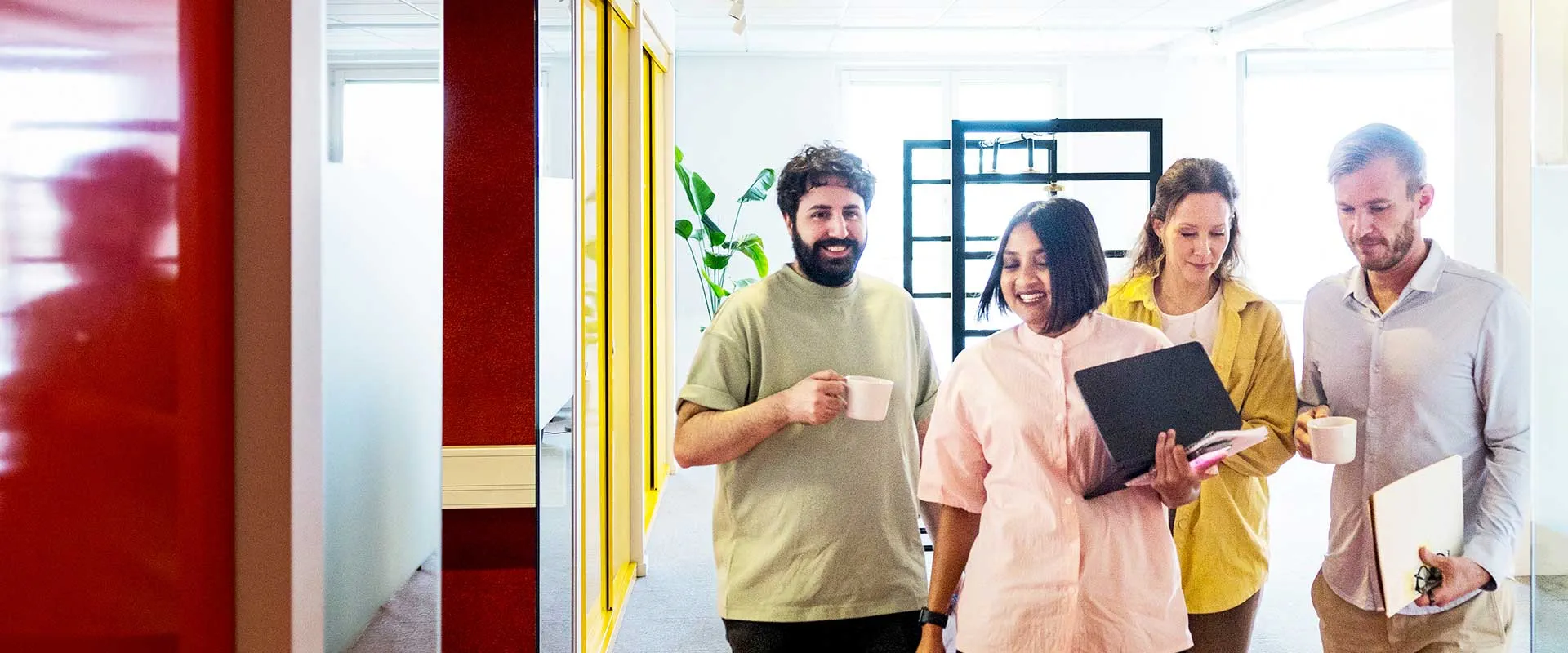  Team walking together in modern office space
