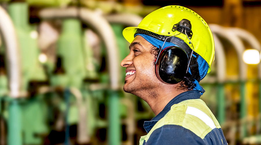  Worker wearing helmet in industrial environment