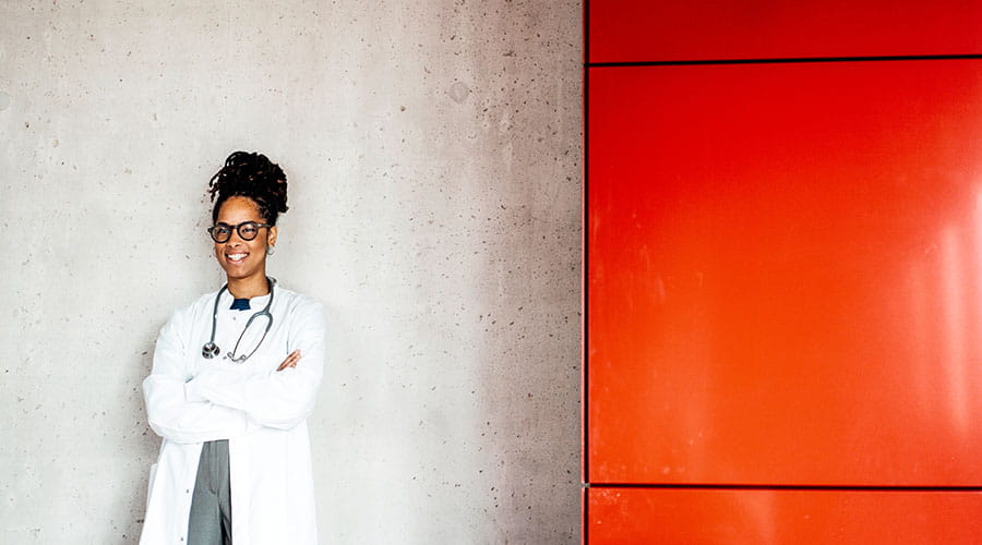  Doctor standing with arms crossed